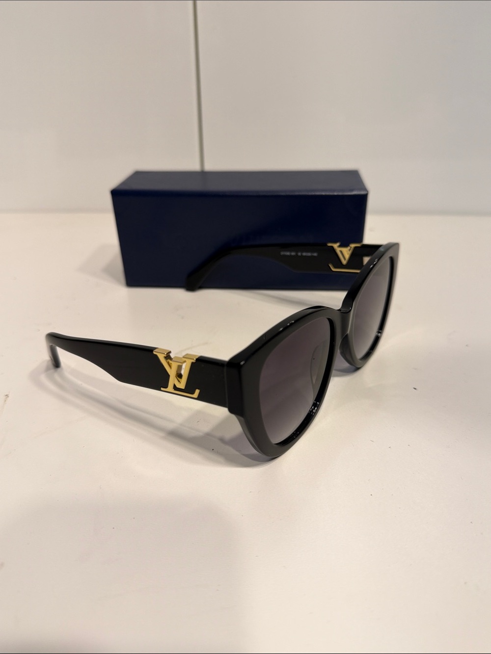 Gently used Louis Vuitton Black Sunglasses with Gold LV Temples